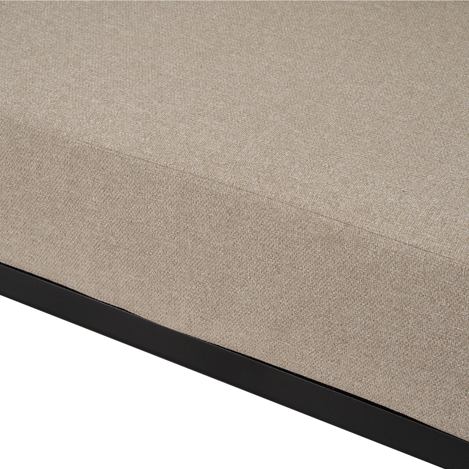 Close-up of beige upholstered cushion on white background.