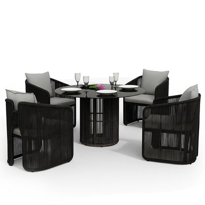 Vellora 4 Seater Wicker Outdoor Dining Set in Black features a round table with a black top and slatted base, surrounded by four rope-style armchairs with light gray cushions.