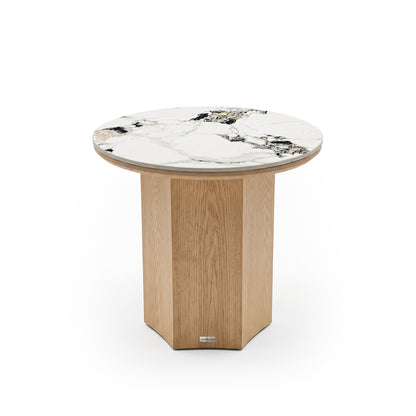 Round accent table with polished marble top and segmented wood base on a white background.