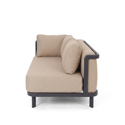 Partial side view of a beige sofa with black frame on white background.