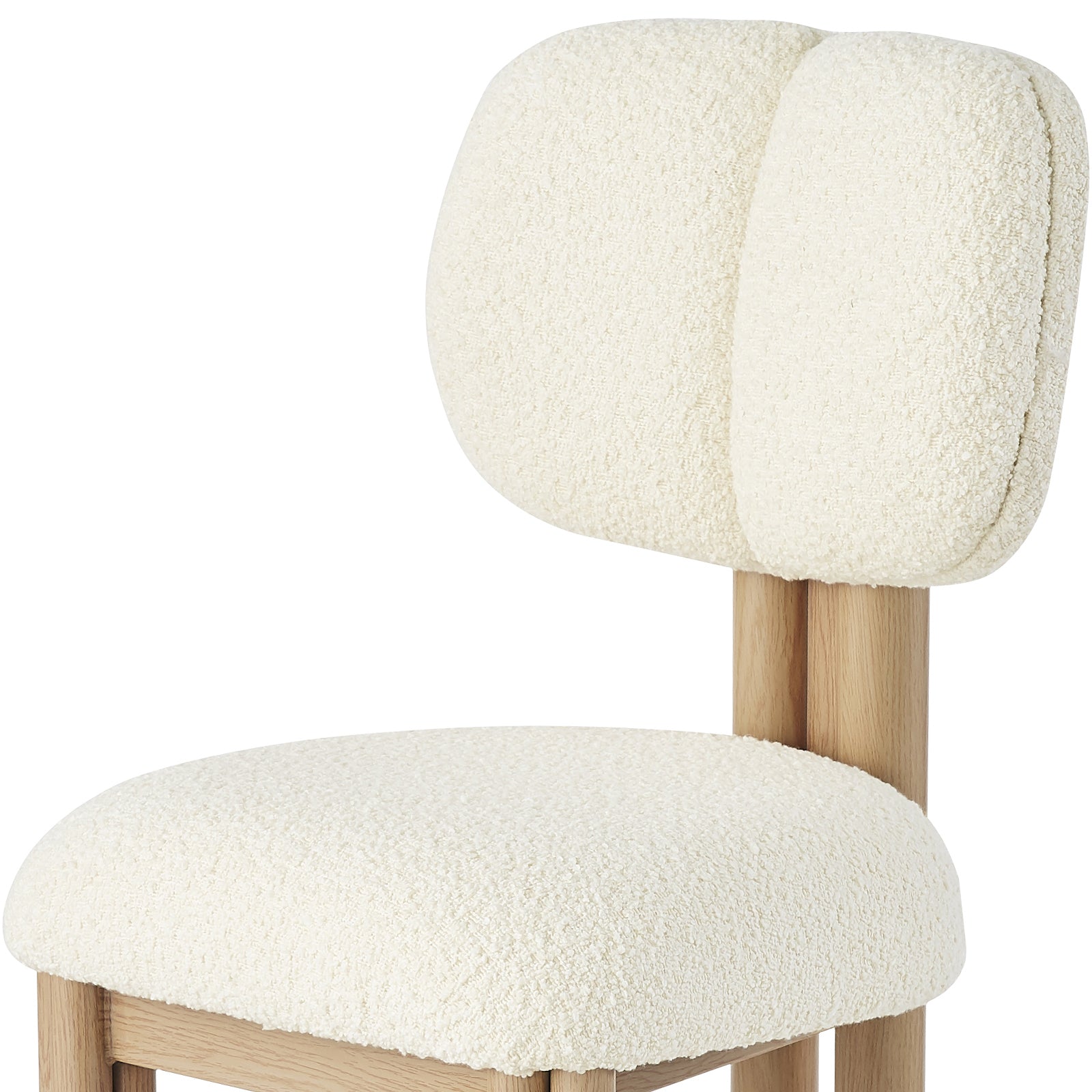 Norii Boucle Fabric Dining Chair in Cream White features a light-wood frame, cream bouclé upholstery, two cushioned backrests, and a rounded seat, offering modern elegance and comfort.
