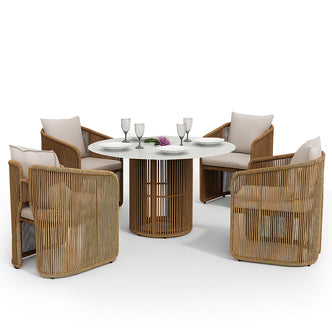 Vellora 4 Seater Wicker Outdoor Dining Set in Natural, featuring a round white tabletop on a rattan base, surrounded by five armchairs with light-neutral cushions and elegant place settings.