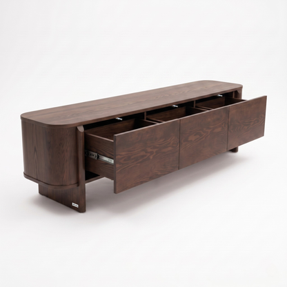 Dark wood sideboard with drawers open on a white background.