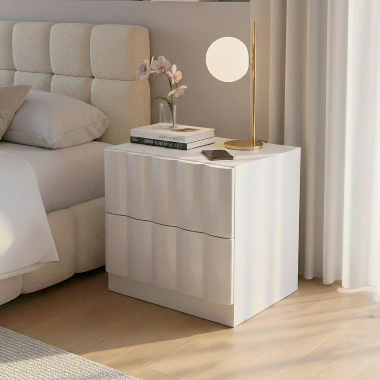 White nightstand in styled bedroom setting with lamp and decor