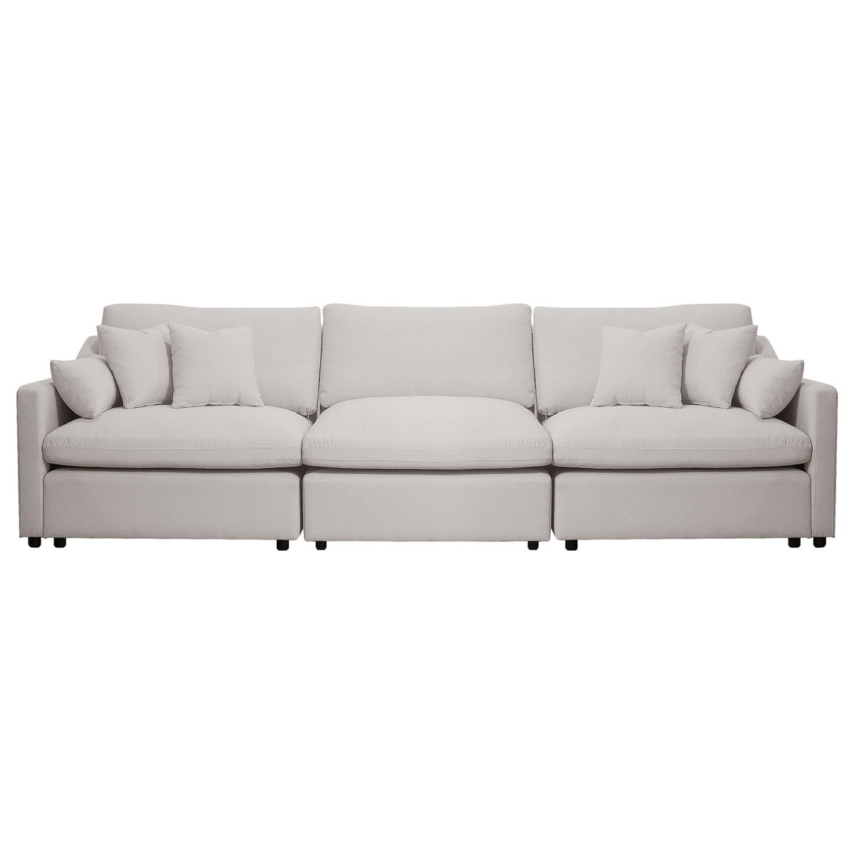 Light beige three-seat sofa with throw pillows on a white background