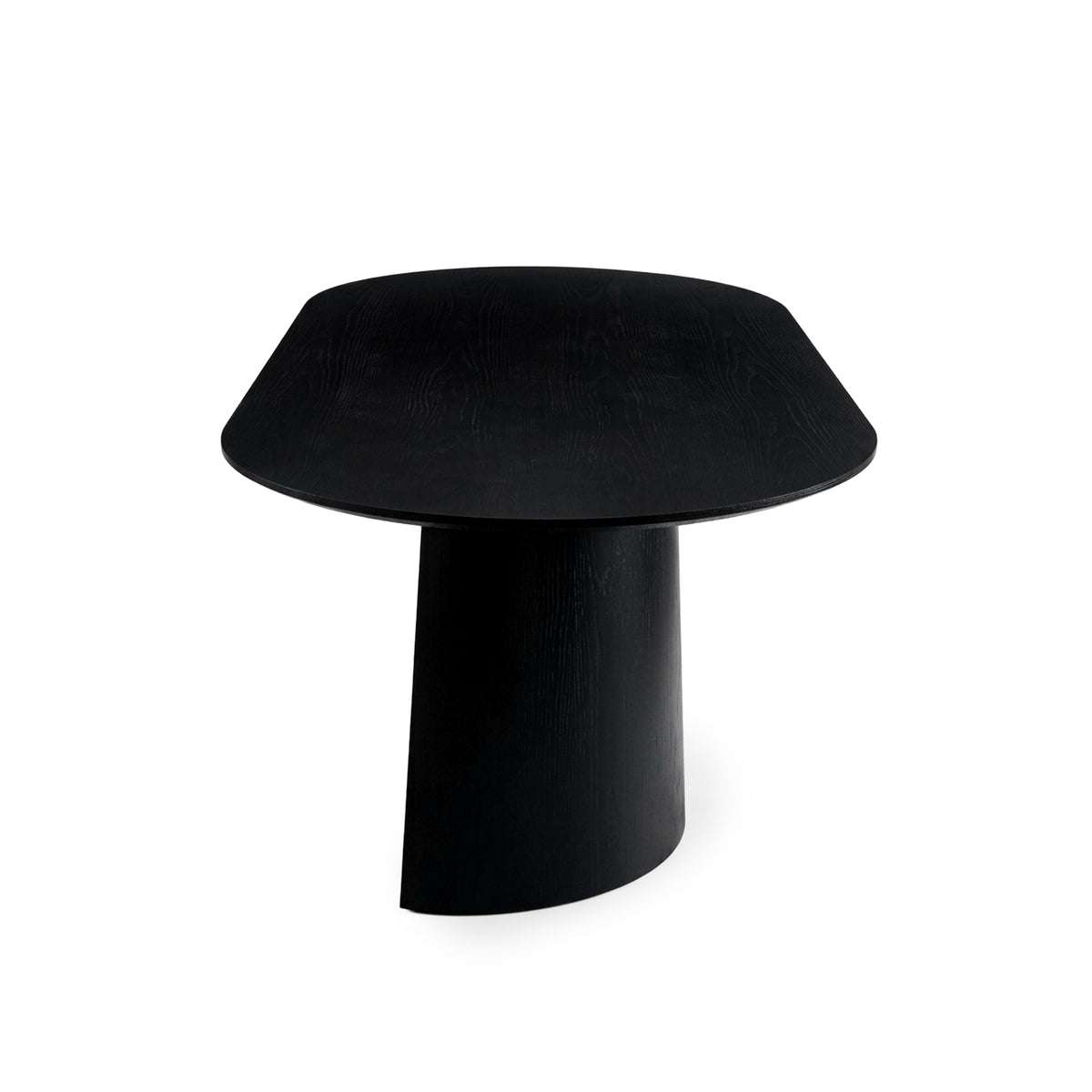 Full view of a modern black table with rounded square top and central pedestal base on white background