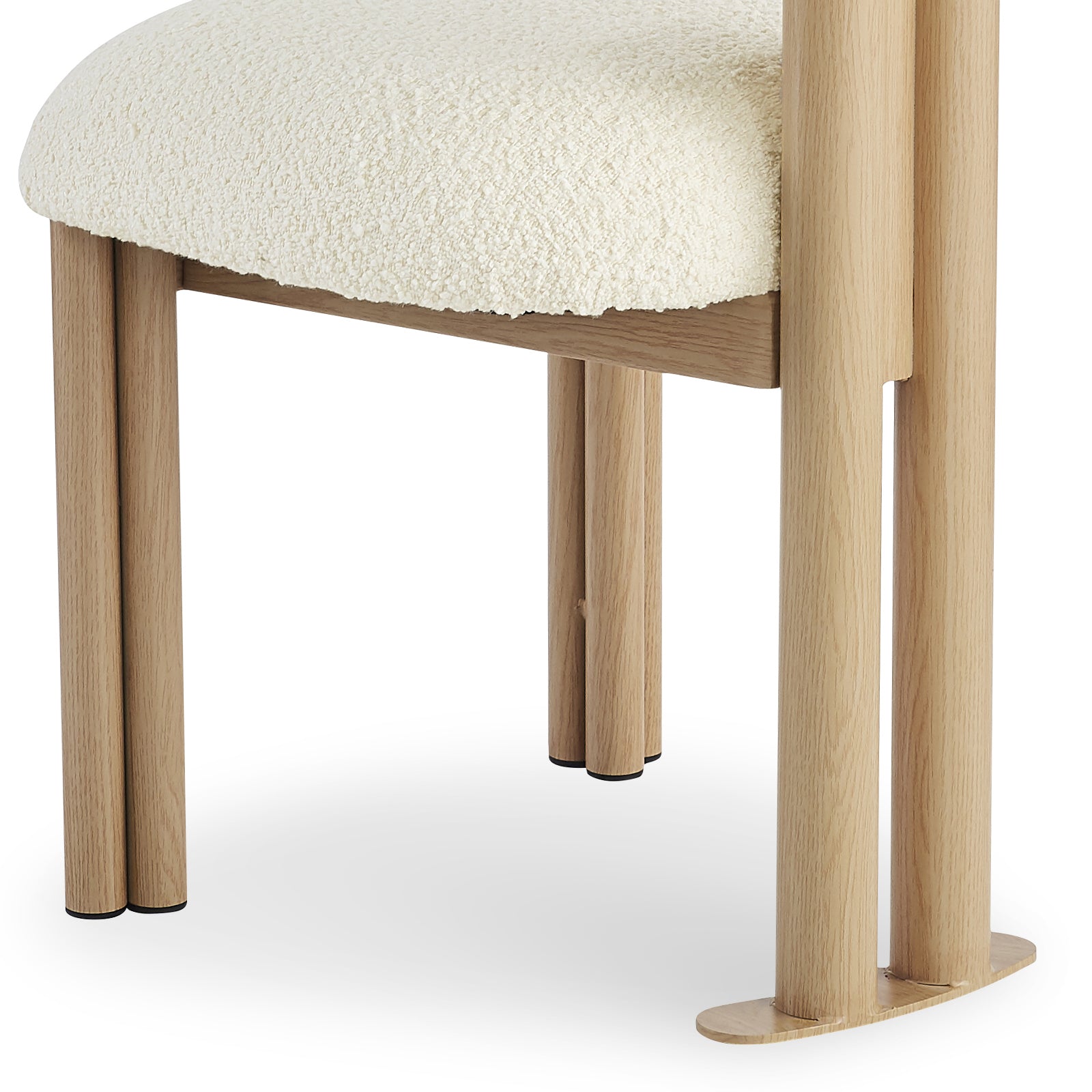 Close-up of the Norii Boucle Fabric Dining Chair in Cream White, highlighting its off-white bouclé seat cushion and natural-wood legs with black foot caps, showcasing modern design and comfort.