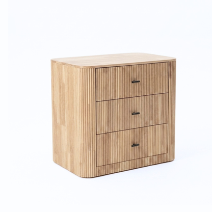 Three-drawer wooden chest with rounded edges and metal handles on a white background