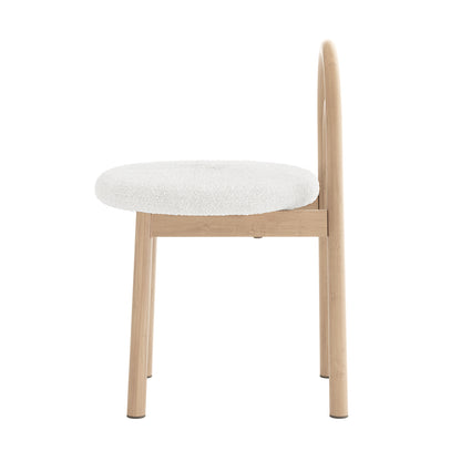 Side view of a modern chair with light wood frame and upholstered seat on a white background