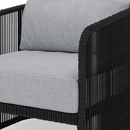 Solari 4 Seater Wicker Outdoor Sofa Set in Black, showcasing a modern armchair with a light-gray cushion and black rope-wrapped frame, ideal for stylish and comfortable outdoor lounging.