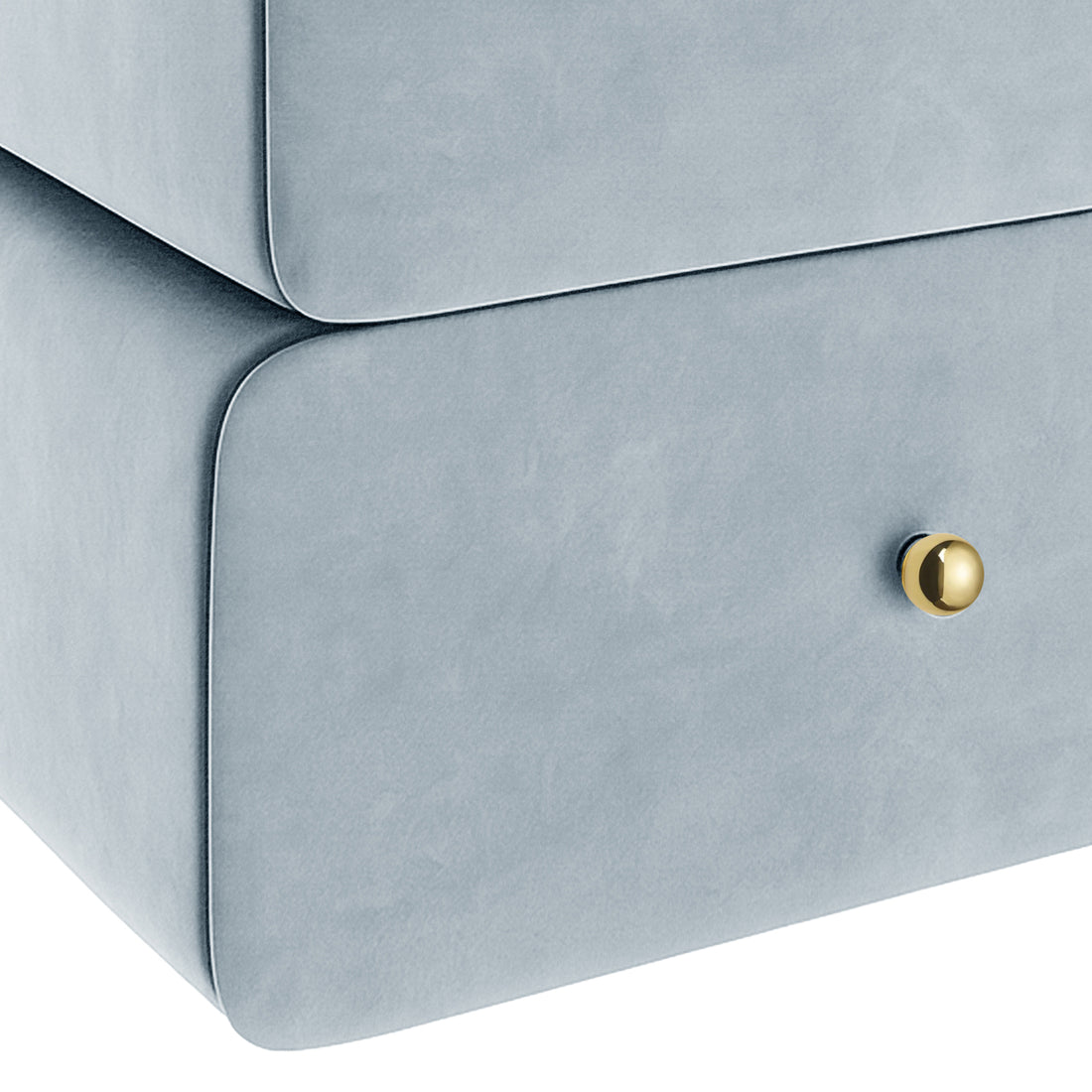 Close-up of light blue upholstered nightstand drawer corner with gold knob on white background